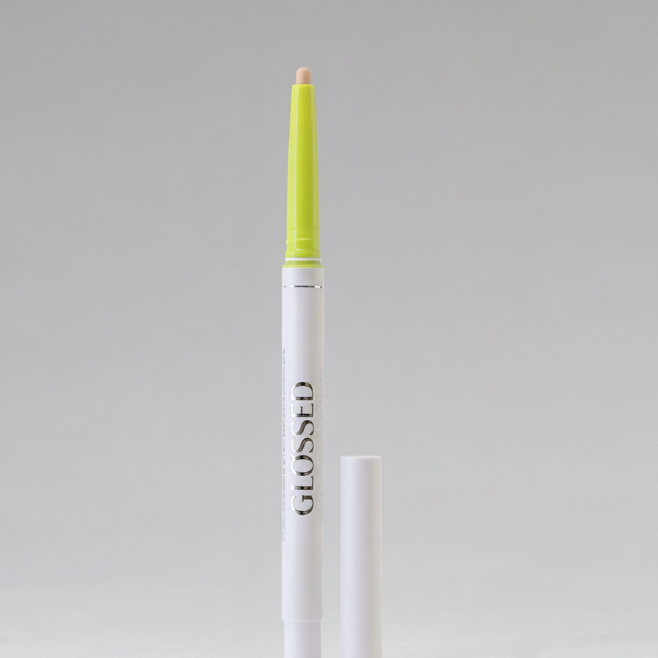 Lip liner with green cap and white body on gray background